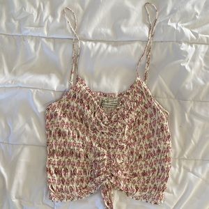 Pink Flower Urban Outfitters crop top. Cinched with tie in front. Brand new.